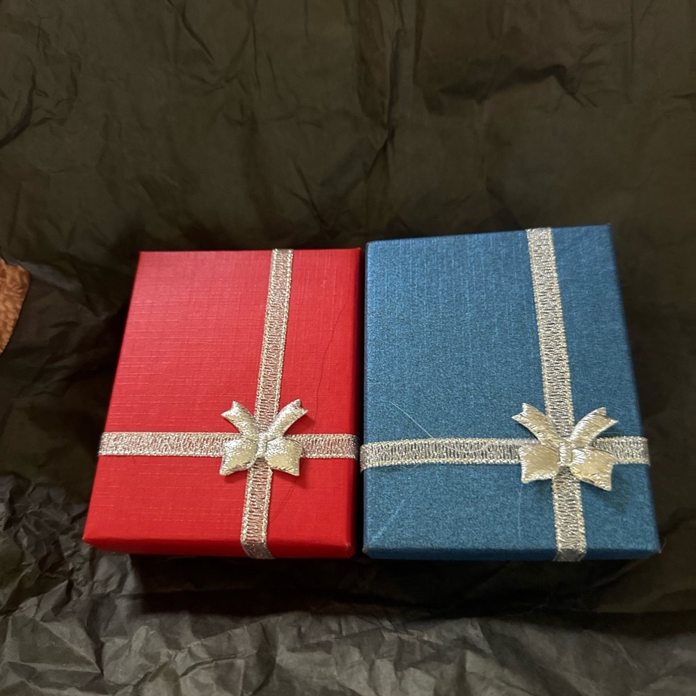 Elegant Red and Blue Gift Boxes with Silver Ribbon